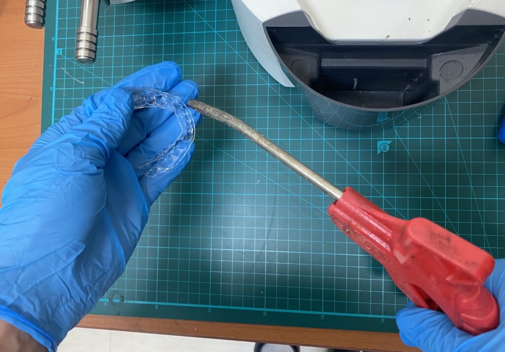 Cut section being polished with a handpiece